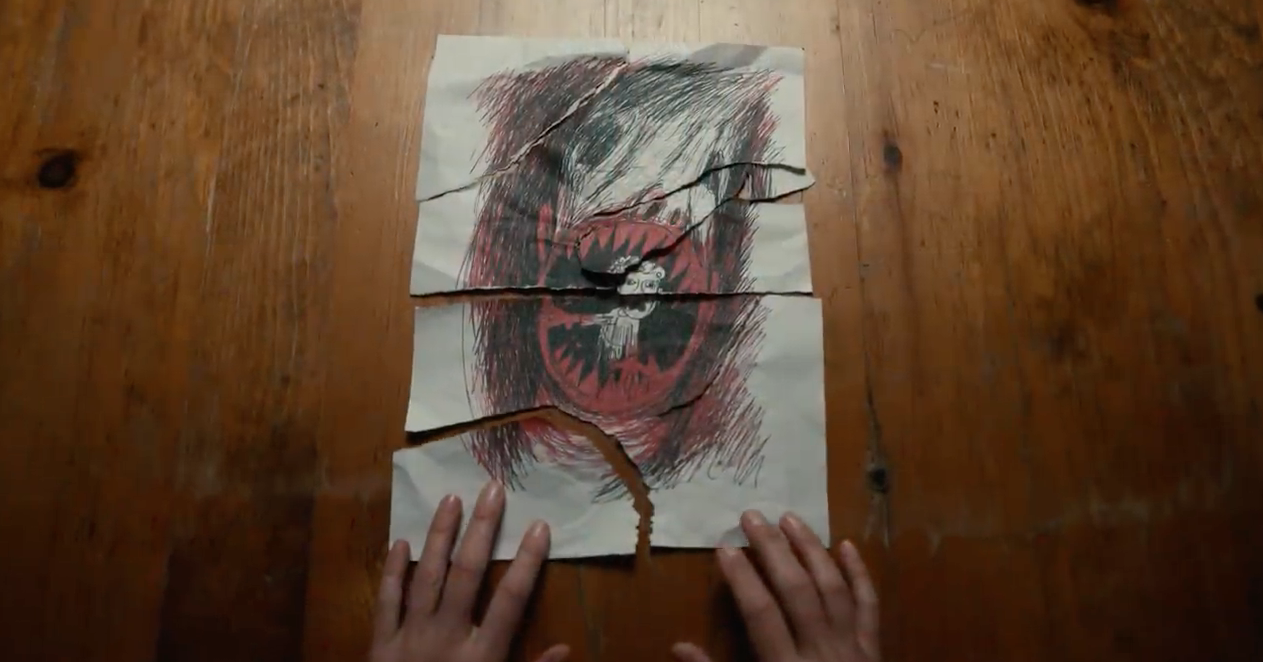 Scar drawing of a giant monster with sharp teeth and a person inside its mouth