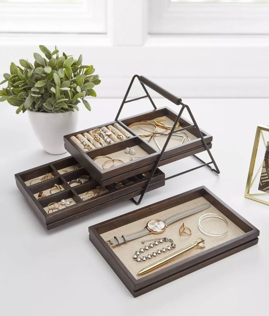 A 3-tier jewelry storage box with removable trays
