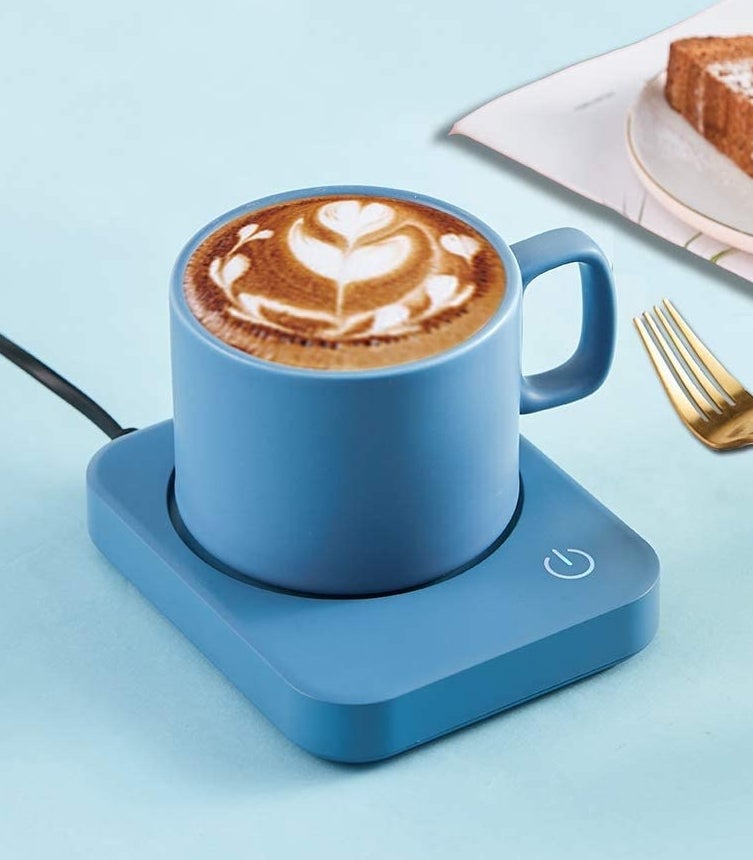 a colourful mug warmer with a mug on top