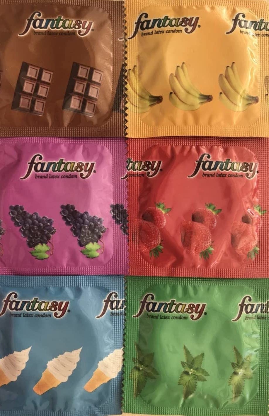 several condom wrappers with graphics of the different flavors on the wrappers