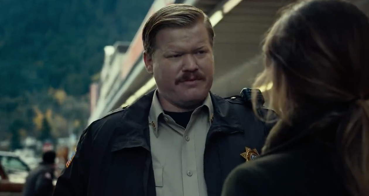 Jesse Plemons as Paul, wearing a sheriff&#x27;s uniform and a mustache