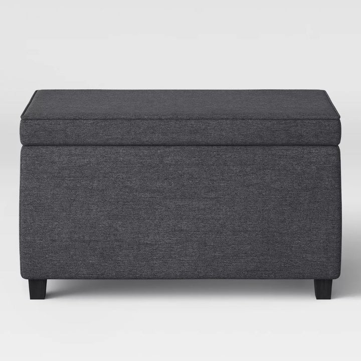 The same dark grey storage ottoman