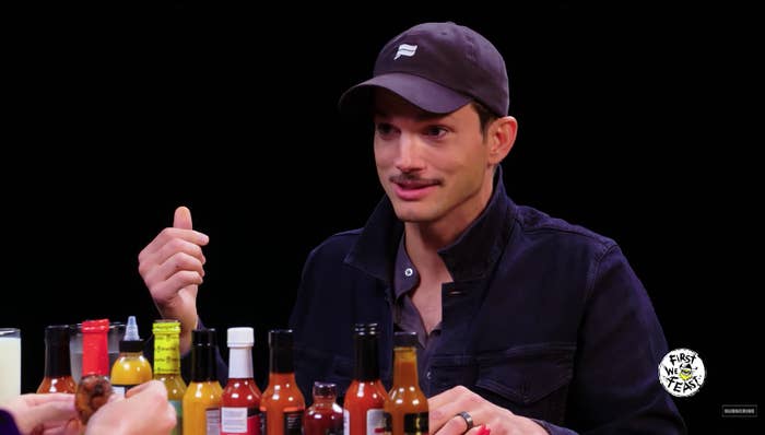 Ashton Kutcher telling a story during a Hot Ones interview