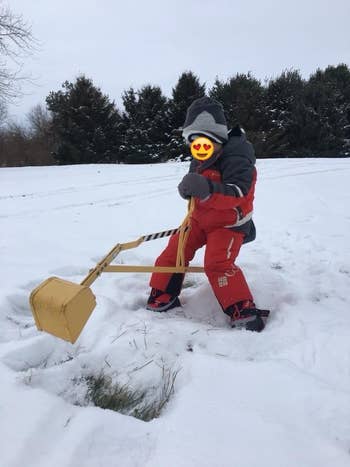 Reviewer's child playing with the digger in the snow