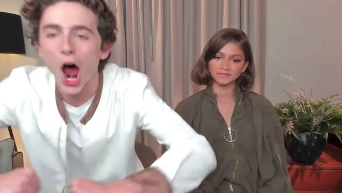 Timothée excitedly roars while Zendaya looks on expressionless