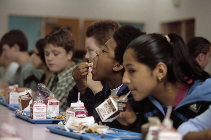 kids in cafeteria drinking milk