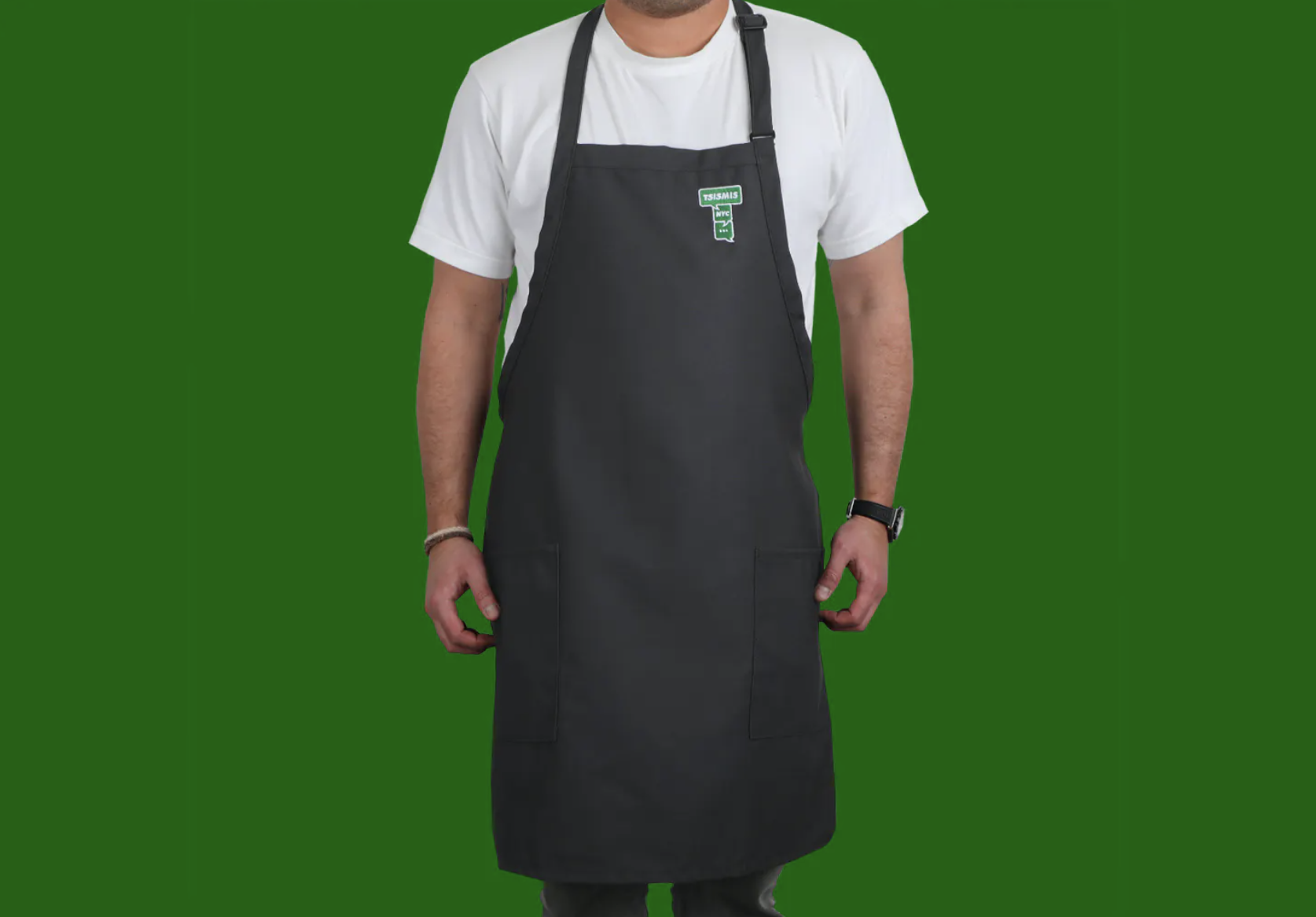 A person wearing the charcoal gray apron