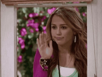 Miley Cyrus as Hannah Montana waving goodbye to her house.