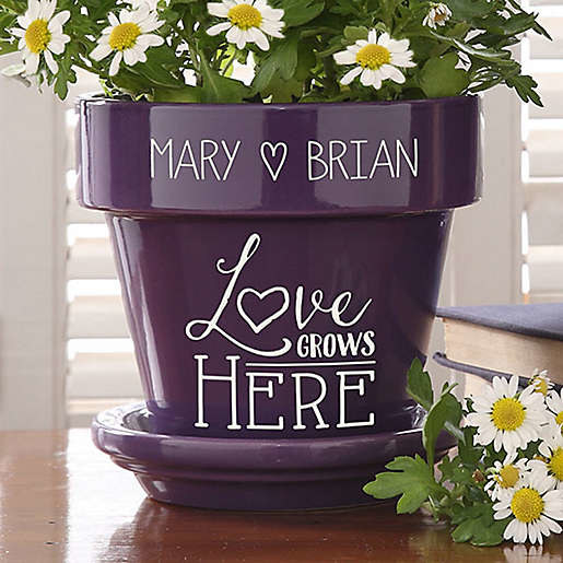 purple flowerpot that says &quot;Love grows here&quot; and &quot;Mary and Brian&quot;