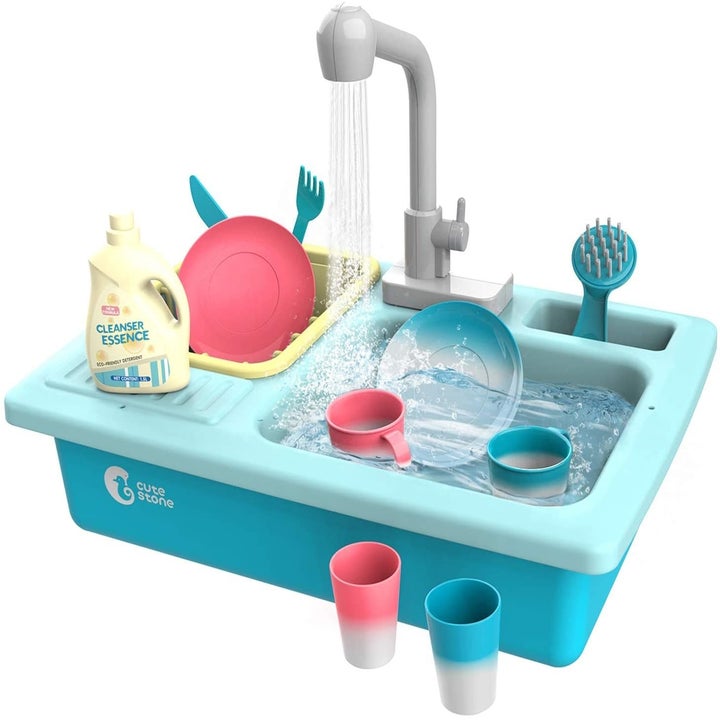 The blue sink with a working faucet and running water and coloring changing accessories