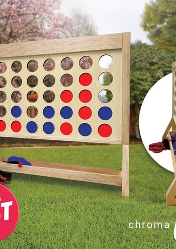 The wooden toy with holes resting on grass