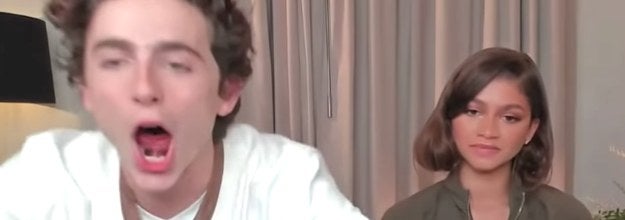 Timothée excitedly roars while Zendaya looks on expressionless