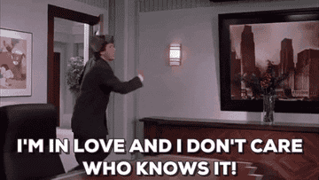 GIF of Will Ferrell in &quot;Elf&quot; saying, &quot;I&#x27;m in love and I don&#x27;t care who knows it!&quot;