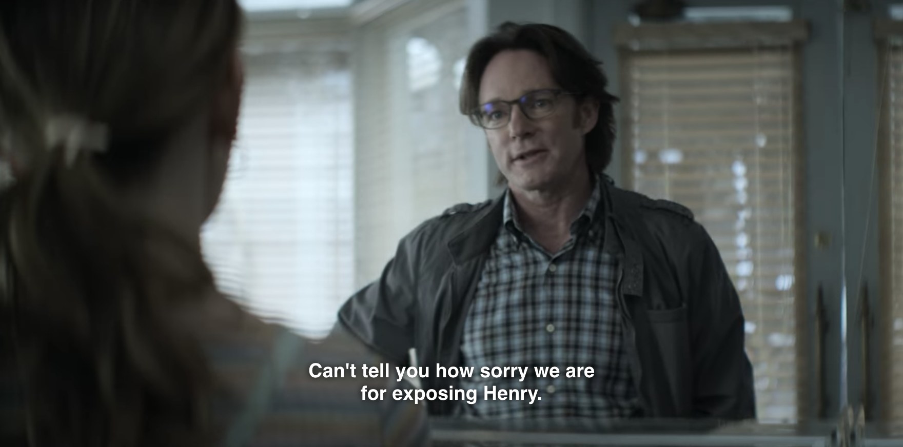 Gil talks to Love (Victoria Pedretti). Caption of what he is saying reads, Can&#x27;t tell you how sorry we are for exposing Henry