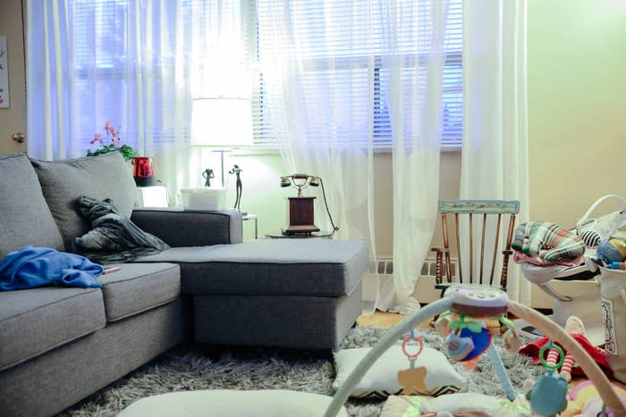 A messy, toy-filled living room.