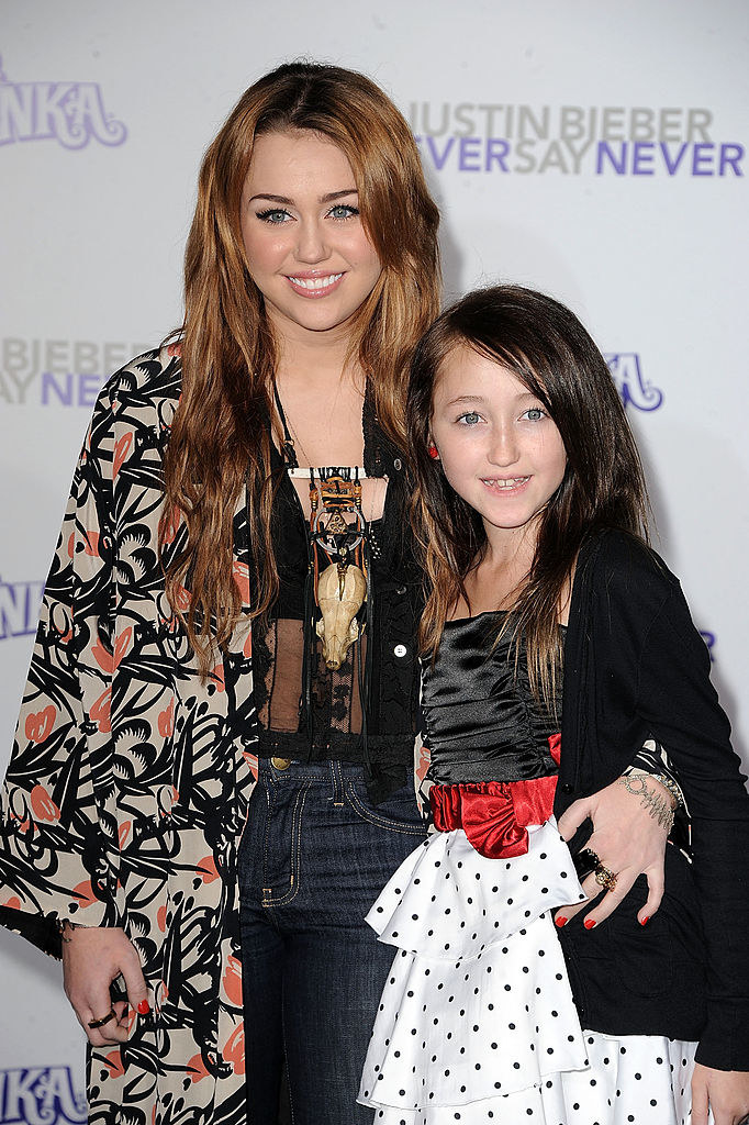 Miley as a teen with Noah as a young kid