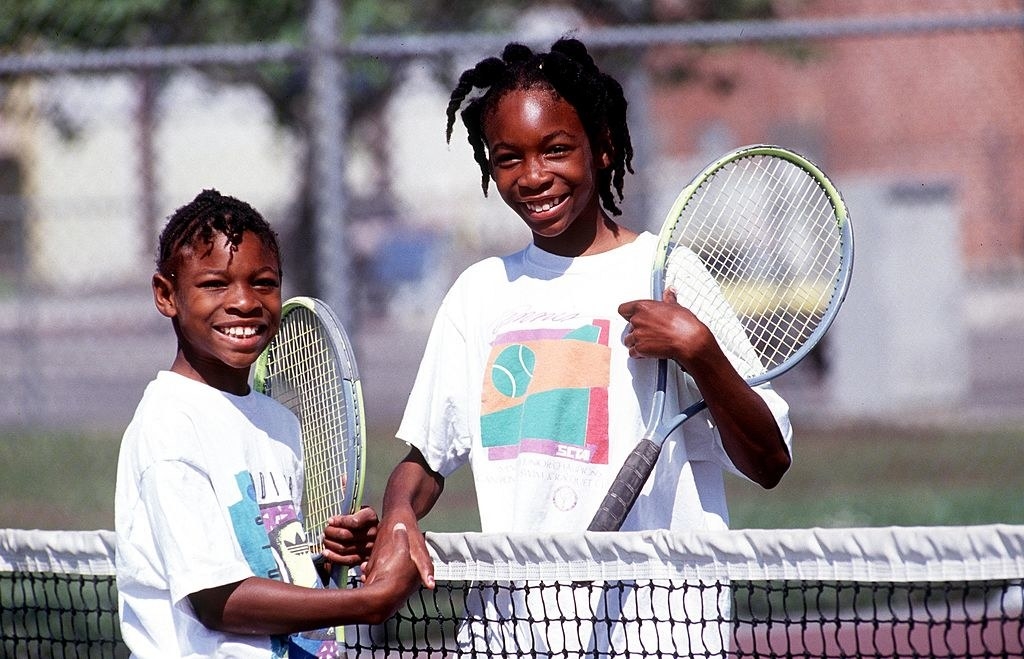 Serena and Venus shaking hands on the court