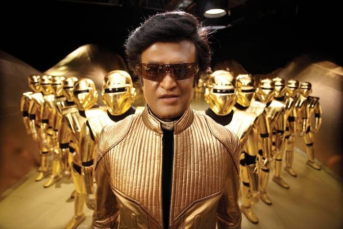 Superstar Rajnikanth starring with cast and crew members in a golden suit for the movie Robot.