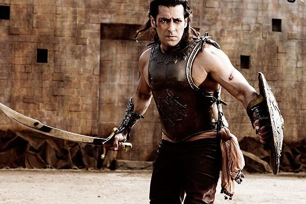 Salman Khan dressed in a warrior&#x27;s attire with a sword in one hand for the movie Veer.