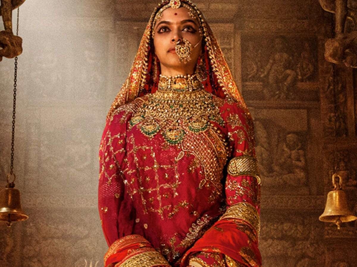 Bollywood actress Deepika Padukone dressed in a heavy red and gold lehenga with traditional gold jewellery for the movie Padmaavat.