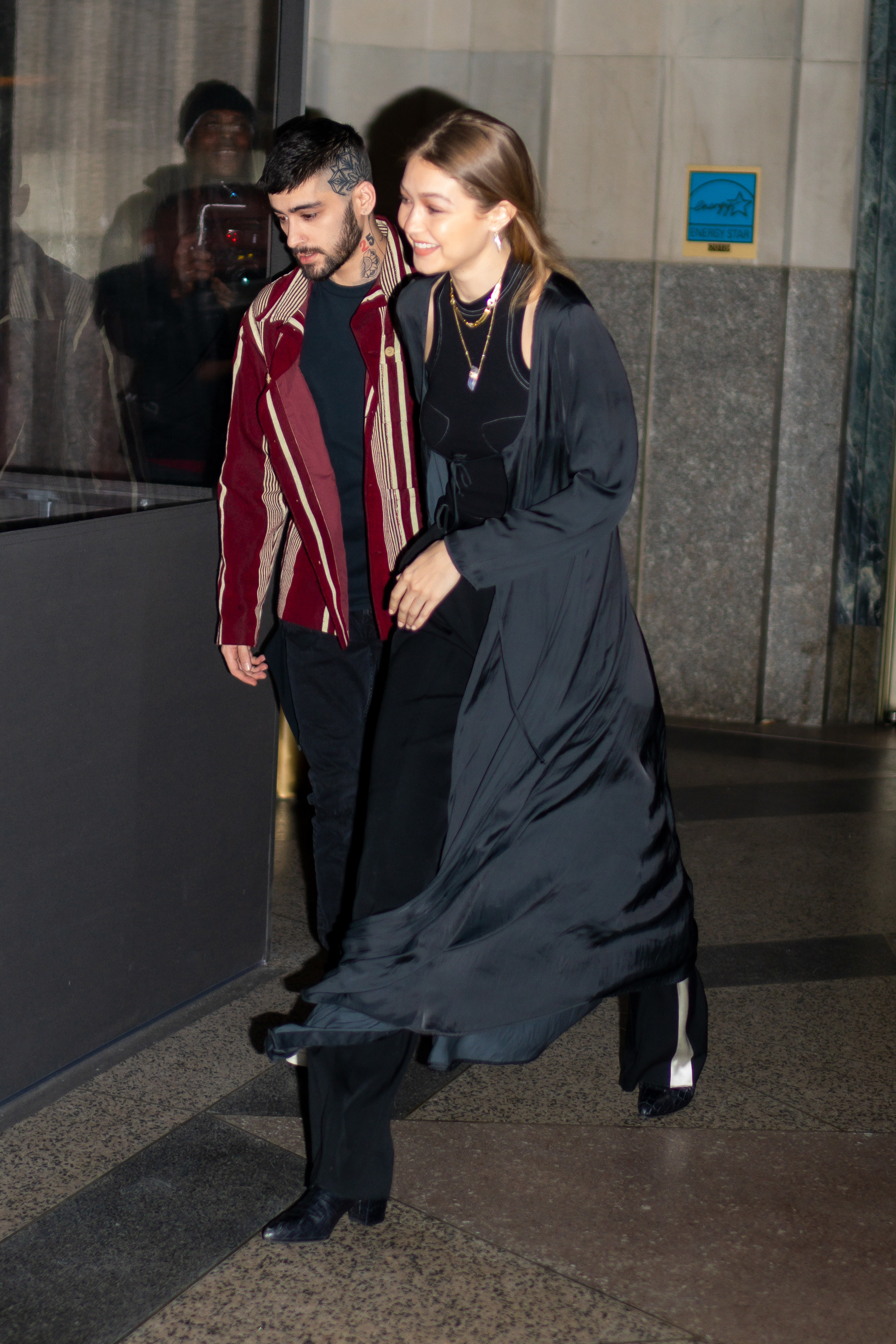 Malik and Hadid exit a buliding together