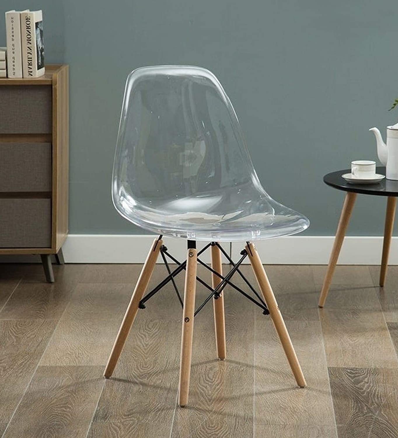 A chair with an acrylic top and wooden legs