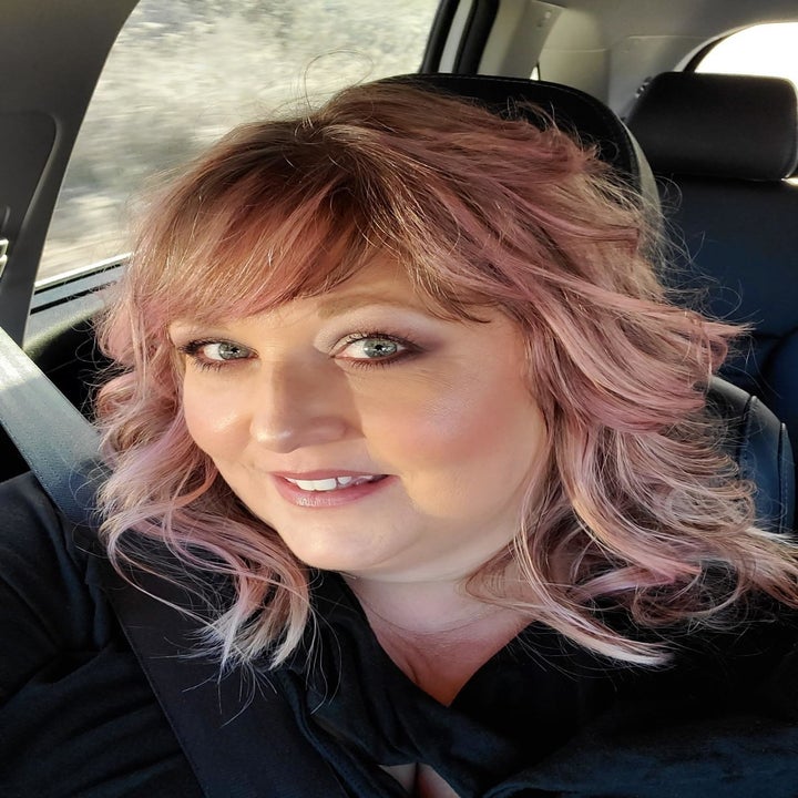 a reviewer with pink hair