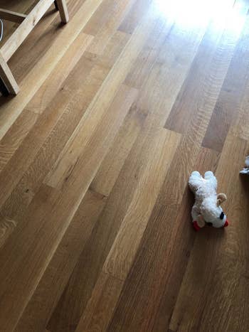 A reviewer's hardwood floor looking clean after using the cleaner