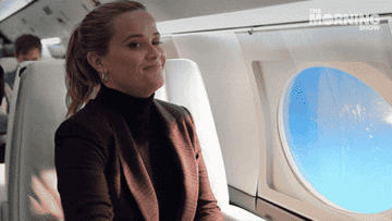 reese witherspoon takes a sip of a cocktail on a flight on &quot;the morning show&quot;