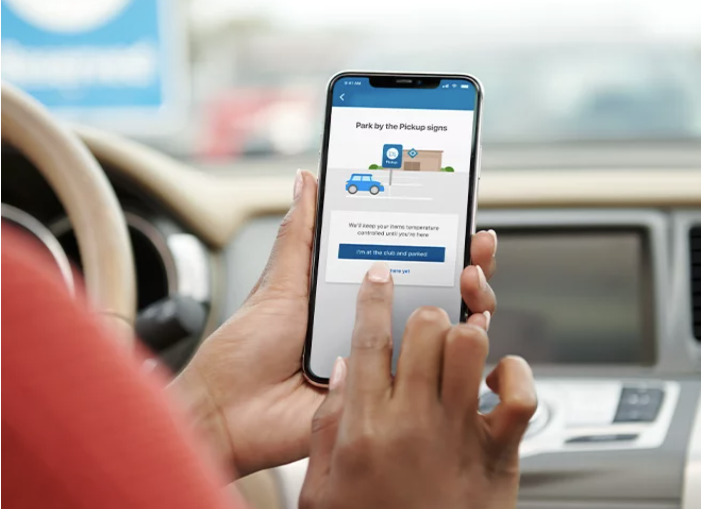 A person uses the Sam&#x27;s Club app to place a pickup order.