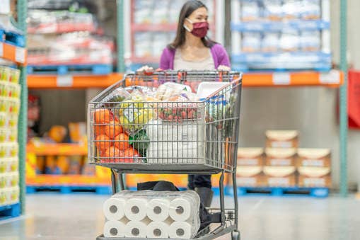 A woman shops in a warehouse store.