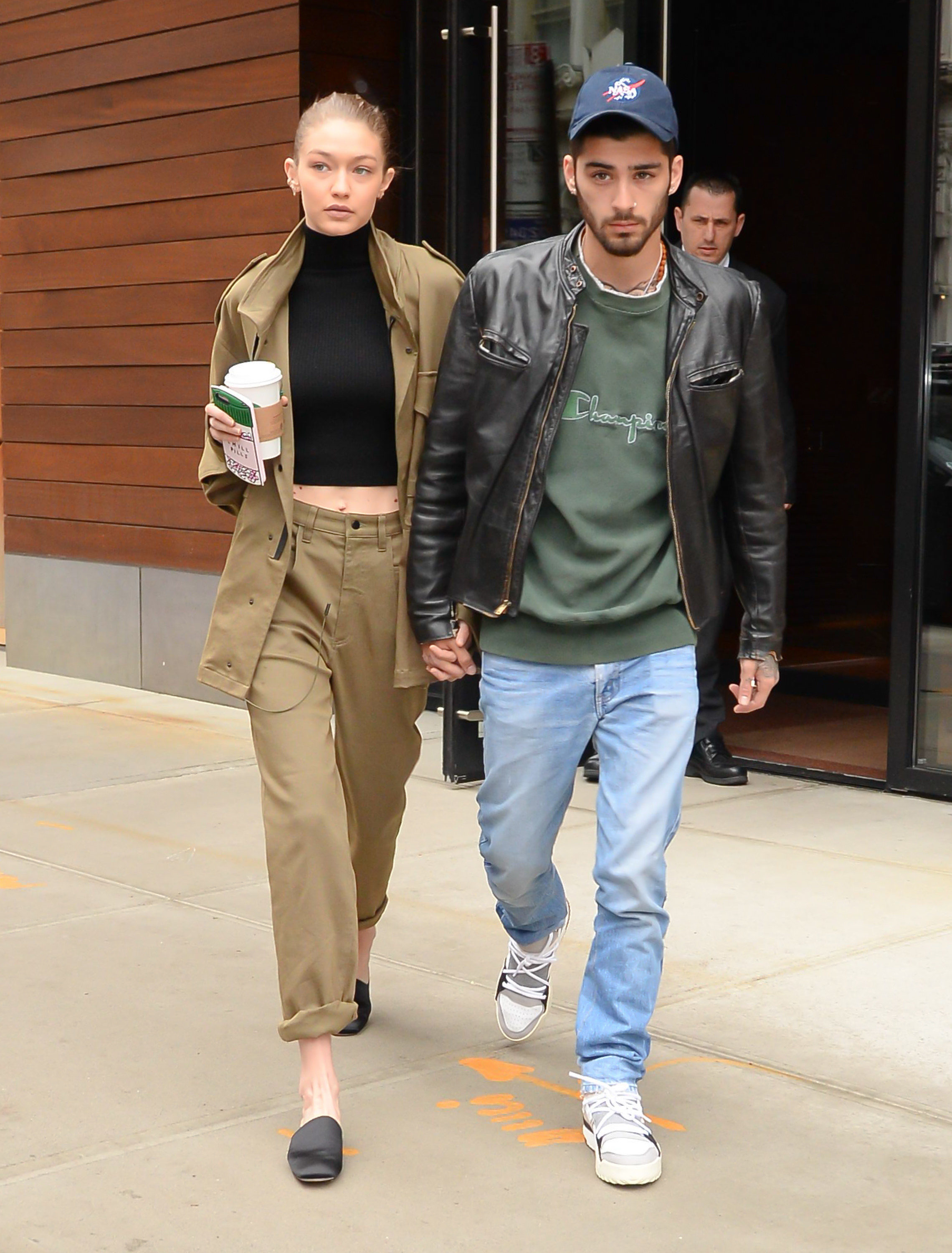 Hadid and Malik walk out of a building together