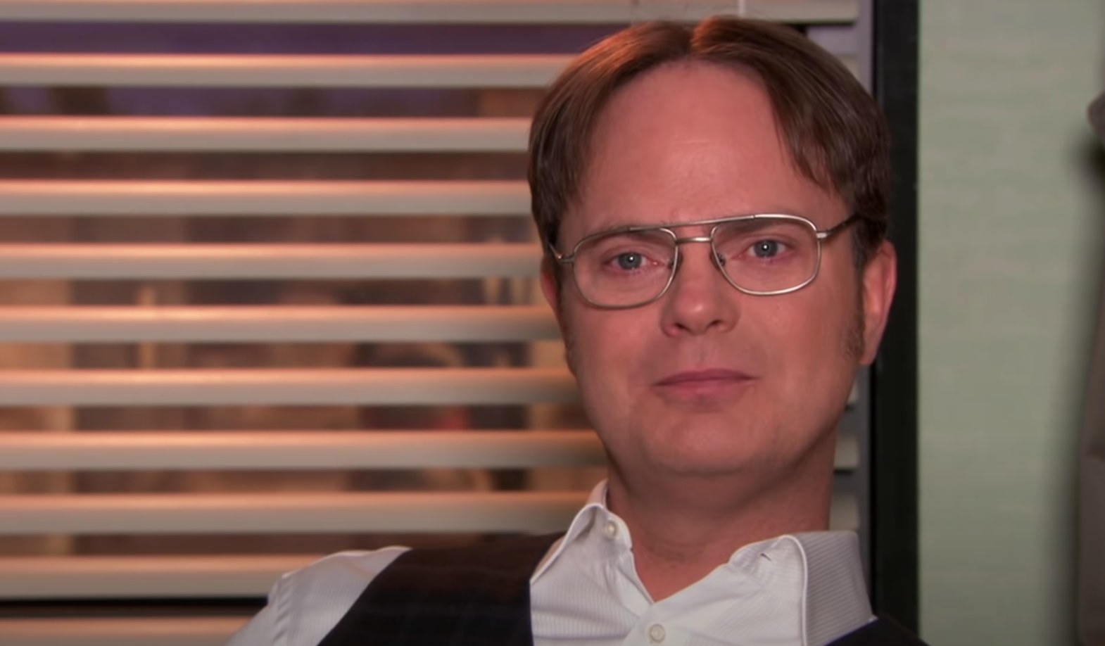 Dwight Schrute staring away at the camera while getting ready to speak