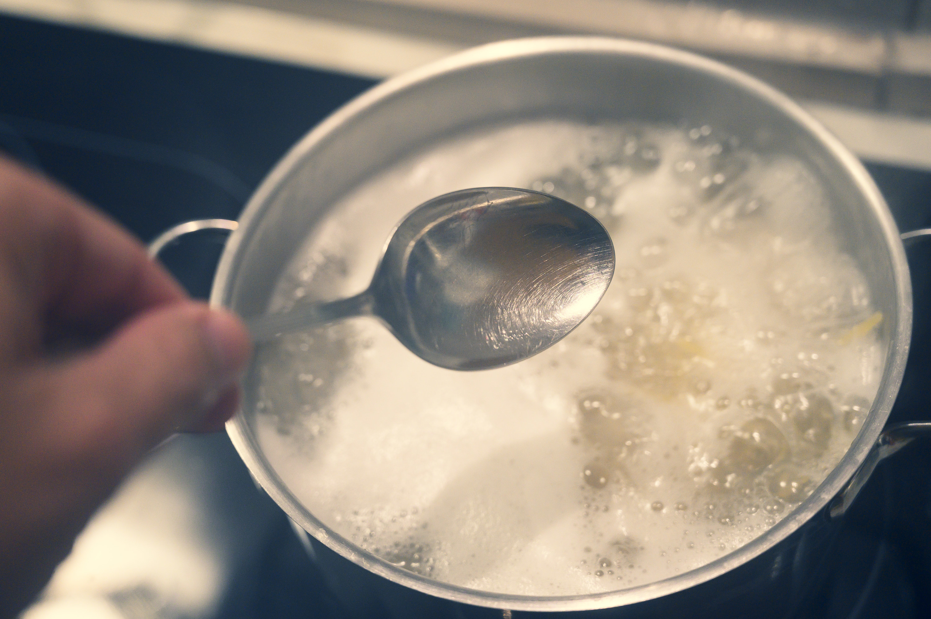Pot of water with pasta, boiling rapidly.