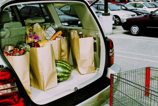 Groceries in a minivan trunk.