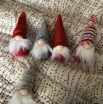 Reviewer photo of five of the gnome ornaments