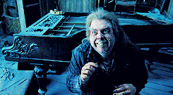 Peter Pettigrew smiling and looking scared