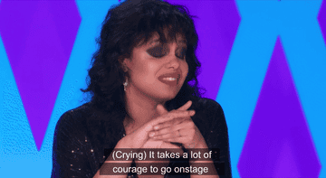 Fefe Dobson crying with text on the screen that says &quot;It takes a lot of courage to go onstage and just show yourself and to be vulnerable&quot;