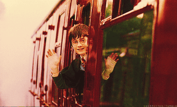 harry waving from the hogwarts express