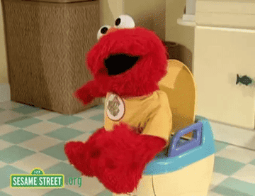 GIF of Elmo on the toilet doing a dance