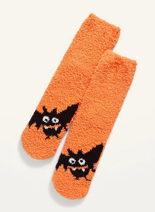 A pair of fuzzy socks with bats on them