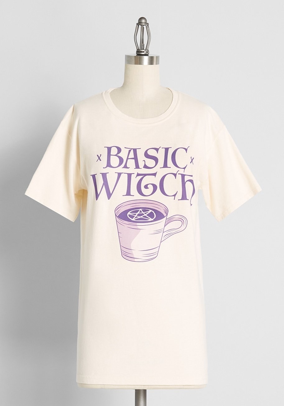 A mannequin wearing a T-shirt that says basic witch