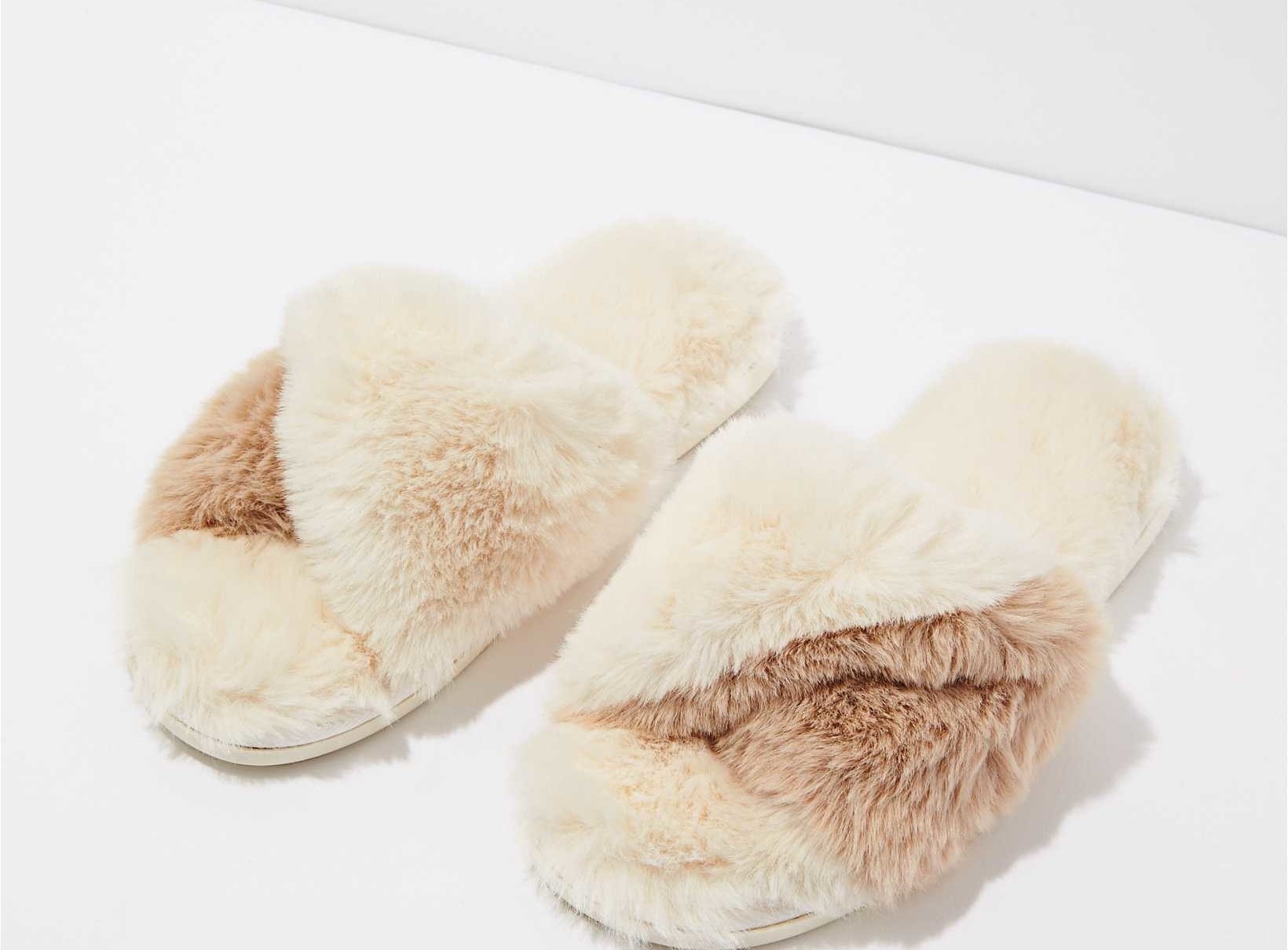 A pair of fuzzy twist slippers