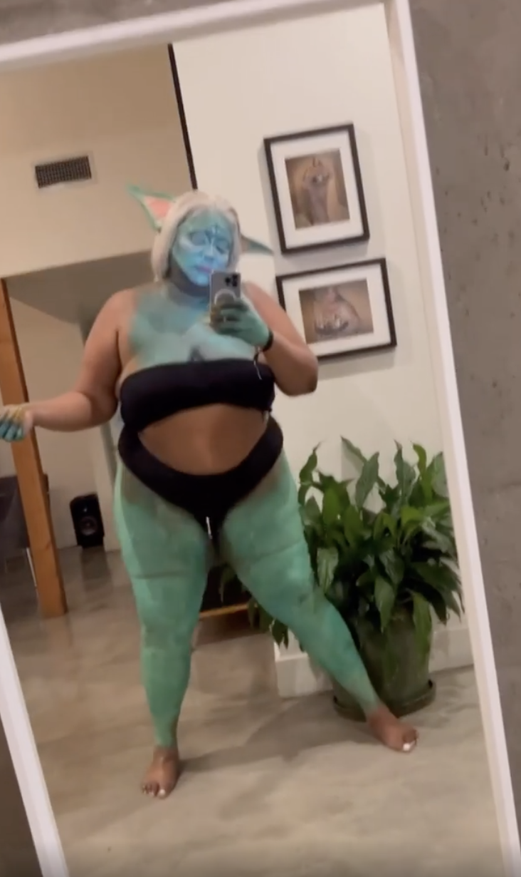 Lizzo dresses as Baby Yoda for Halloween, gives cameras Jedi hand wave