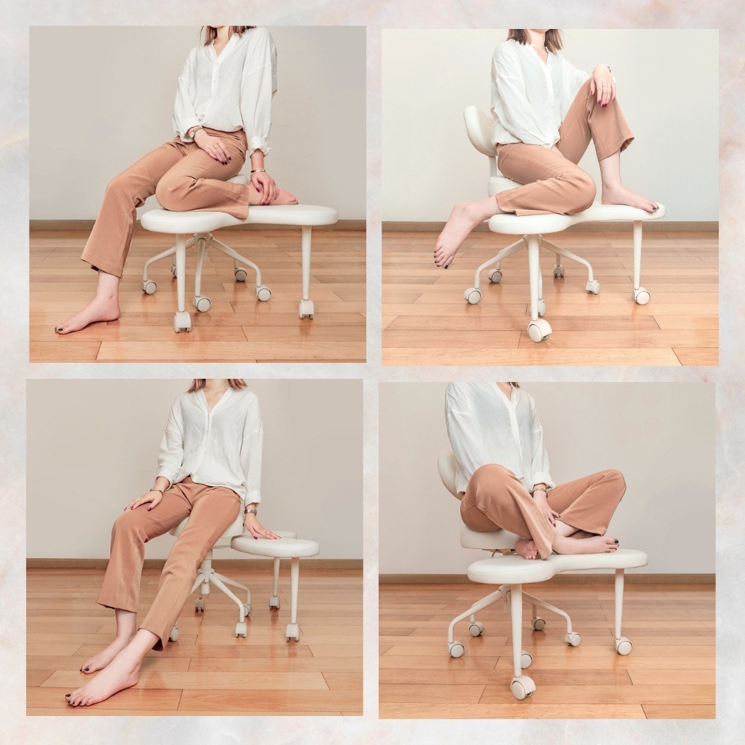 model sitting on the white chair which has a platform under the seat for your feet or knees