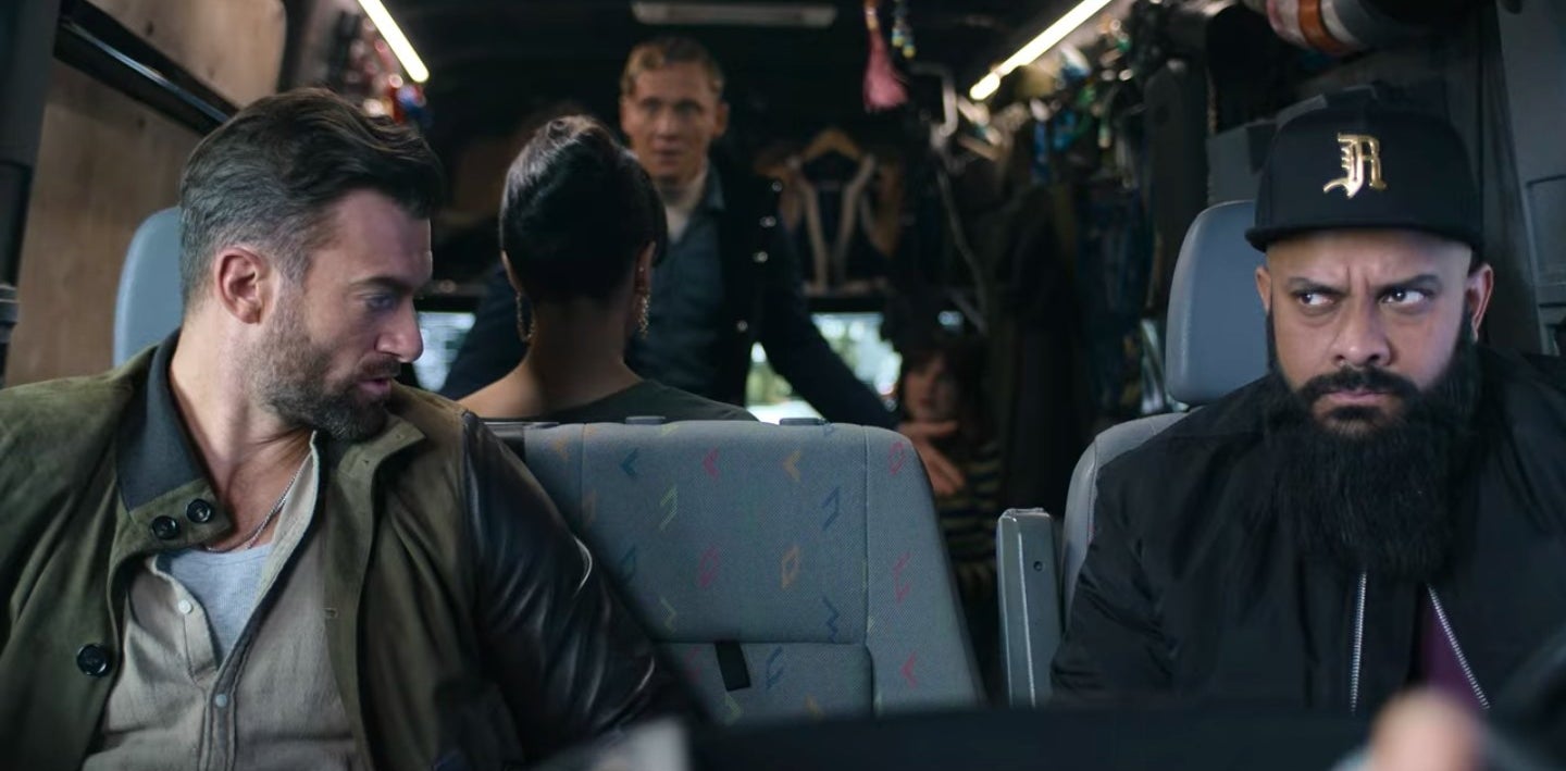 Rolph and Brad sitting at the front of a van while Dieter and Gwendoline talk in the back in &quot;Army of Thieves&quot;
