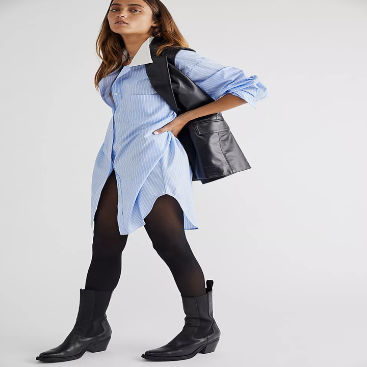 model wearing shirt with black tights and boots