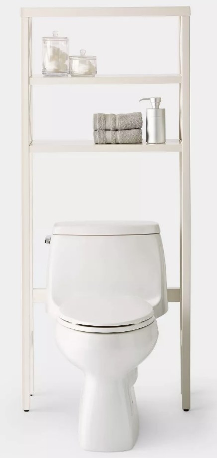 A white over the toilet, three tier shelf