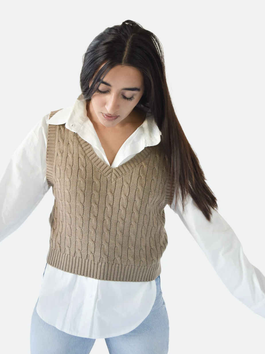 model wearing vest over a white shirt