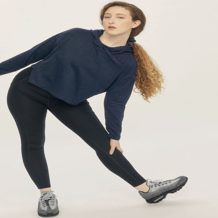 model wearing the hoodie in the color midnight